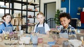  Presentation with handcraft - Slide set with diligent schoolkids looking at camera background and a mint green colored foreground