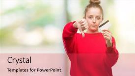  Presentation with credit card - Presentation having discontent - young blonde woman holding credit background and a red colored foreground