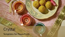  Presentation with sweets - PPT theme consisting of happy diwali - indian sweets with traditional lamps background and a gold colored foreground