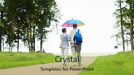  Presentation with old couple walking - PPT theme consisting of down country road under rainbow background and a yellow colored foreground