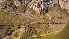  Presentation with cave - PPT theme featuring drone-aerial-view-of-vardzia background and a coral colored foreground