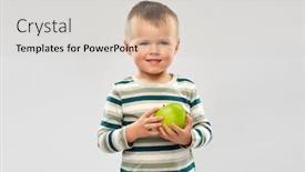  Presentation with health education - Presentation theme with education health and childhood concept - portrait of smiling little boy holding green apple over grey background background and a light gray colored foreground