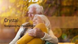 Presentation with cartoon elderly - Audience pleasing PPT theme consisting of elderly couple embracing in autumn backdrop and a gold colored foreground