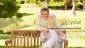  Presentation with elderly - Amazing PPT theme having elderly couple in the park backdrop and a blonde colored foreground