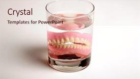  Presentation with water glass - Beautiful presentation theme featuring elderly denture - false teeth in a glass backdrop and a lemonade colored foreground