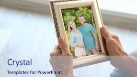  Presentation with young happy couple - Audience pleasing slides consisting of elderly man holding photo frame backdrop and a sky blue colored foreground