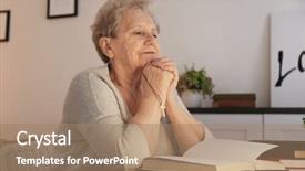 Presentation with woman praying over bible - Amazing PPT theme having elderly woman praying over bible backdrop and a coral colored foreground