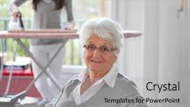  Presentation with elderly home - Theme enhanced with closeup of elderly woman with home help background and a light gray colored foreground