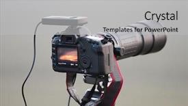  Presentation with lens - Slide deck with elecron - slr camera on tripod background and a light gray colored foreground