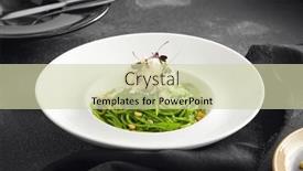  Presentation with white cheese - Presentation featuring elegantly-plated-pesto-spaghetti and a soft green colored foreground