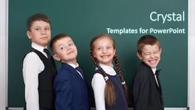  Presentation with pupil - Presentation theme with elementary school boy near blank chalkboard background dressed in classic black suit group pupil education concept background and a ocean colored foreground