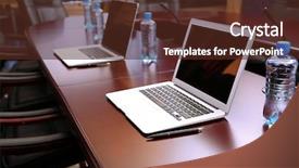  Presentation with conference table microphones - PPT theme having empty conference room with laptops background and a tawny brown colored foreground