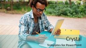  Presentation with writing - Beautiful PPT theme featuring engineer graduation - serious african young man writing backdrop and a light blue colored foreground