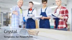  Presentation with foreman - Presentation design with engineering intern - mature foreman pointing at table background and a light blue colored foreground