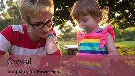  Presentation with displaying a happy mother cudd - Colorful slides enhanced with enjoying free time using tablet backdrop and a violet colored foreground