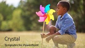  Presentation with pinwheel - Colorful presentation enhanced with eolienne - african kid playing with pinwheel backdrop and a yellow colored foreground