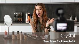  Presentation with blog - PPT theme featuring excited young girl recording her video blog episode about new cosmetic products while sitting at the kitchen table at home and applying make-up background and a dark gray colored foreground