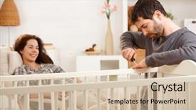  Presentation with happy baby - Presentation theme having expecting baby man fixing crib background and a soft green colored foreground