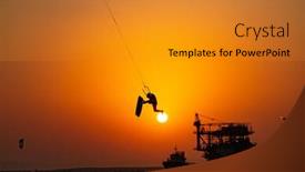  Presentation with extreme - Slide set featuring extreme sport kitesurfing against offshore jack up rig in the middle of the sea at sunset time background and a gold colored foreground