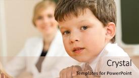  Presentation with camera - Presentation theme having face of clever schoolboy looking at camera in classroom with his teacher at background background and a coral colored foreground
