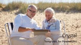  Presentation with family tourism - Audience pleasing presentation consisting of family age travel tourism and people concept - happy senior couple with tablet pc computer resting in folding chairs on summer beach backdrop and a coral colored foreground