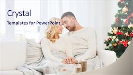  Presentation with happy holidays - Presentation enhanced with family christmas holidays love and people concept - happy couple covered with plaid sitting on sofa at home background and a sky blue colored foreground