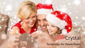  Presentation with family photo - Colorful presentation design enhanced with family christmas x-mas winter happiness and people concept - smiling family in santa helper hats taking picture with photo camera backdrop and a coral colored foreground