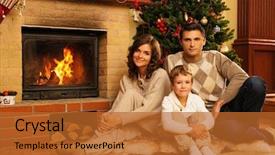 Presentation with christmas fireplace log fire burns - PPT theme consisting of family near fireplace in christmas background and a red colored foreground