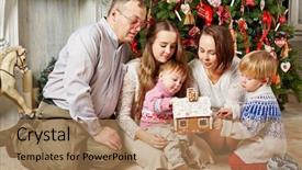  Presentation with gingerbread house - Presentation featuring family of five sits under christmas tree and looks over gingerbread house in hands of mother younger children touch it background and a coral colored foreground