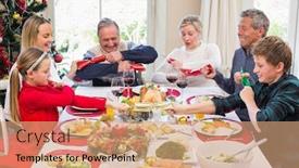  Presentation with living room family - Theme with family pulling christmas crackers at the dinner table at home in the living room background and a coral colored foreground