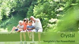  Presentation with crossing bridge - Amazing PPT theme having family sitting on a bridge backdrop and a  colored foreground