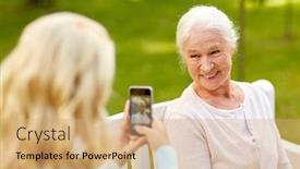  Presentation with young happy people smiling - Beautiful slides featuring family technology and people concept - young daughter with smartphone photographing her happy smiling senior mother at park backdrop and a coral colored foreground