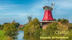  Presentation with windmills - Beautiful theme featuring famous twin windmills at the village of greetsiel german north sea region backdrop and a tawny brown colored foreground