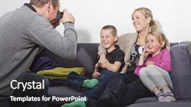  Presentation with family photo - Slide deck having father taking a photo of his family siting in the sofa background and a dark gray colored foreground