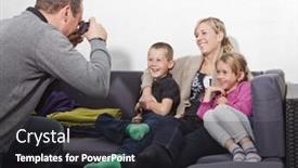  Presentation with family photo - Amazing slides having father taking a photo of his family siting in the sofa backdrop and a dark gray colored foreground