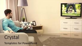  Presentation with film - PPT theme with favourite film - young handsome man watching tv background and a coral colored foreground