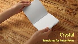  Presentation with brochure - Theme having hands holding blank open brochure background and a tawny brown colored foreground