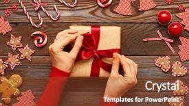  Presentation with christmas gift wrap - Presentation theme featuring female hands on christmas gift background and a tawny brown colored foreground