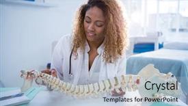  Presentation with spine - Cool new presentation with female pelvis - smiling physiotherapist holding spine model backdrop and a light blue colored foreground