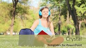  Presentation with lens - Cool new presentation with female student studying on campus seated in a meadow full of flowers shot with tilt and shift lens backdrop and a yellow colored foreground