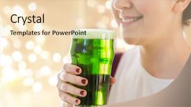  Presentation with green lights - Colorful theme enhanced with alcohol and st patricks day concept - close up of woman with green beer in glass over festive lights on beige background backdrop and a lemonade colored foreground