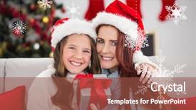  Presentation with snowflakes - Amazing PPT theme having festive mother and daughter holding christmas present against hanging snowflakes backdrop and a tawny brown colored foreground