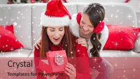  Presentation with twinkling stars - PPT theme consisting of festive mother and daughter with a christmas gift against twinkling stars background and a red colored foreground