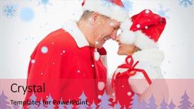  Presentation with older couple - Cool new PPT theme with festive older couple smiling at each other and holding gift against snowflakes and fir trees in blue backdrop and a red colored foreground