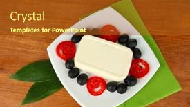  Presentation with feta cheese - Colorful theme enhanced with feta cheese on plate decorated with olives and tomatoes on wooden table close-up backdrop and a tawny brown colored foreground