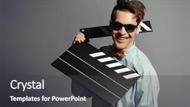  Presentation with clapper - Amazing PPT theme having film producer funny - cheerful young man holding clapper backdrop and a dark gray colored foreground