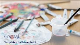  Presentation with water cup - PPT theme with fine art creativity and artistic tools concept - paintbrush soaking in cup of water and color on paper tissue background and a sky blue colored foreground