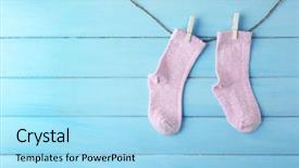  Presentation with light hanging - Beautiful slides featuring first born - baby socks hanging on light backdrop and a arctic colored foreground