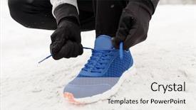  Presentation with shoe - Beautiful theme featuring fitness sport people sportswear and footwear concept - close up of man foot and hands tying shoe lace in winter outdoors backdrop and a white colored foreground