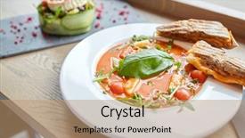  Presentation with haute cuisine - Presentation theme featuring food dinner haute cuisine and cooking concept - plate of delicious gazpacho soup sandwich and salad at restaurant background and a coral colored foreground